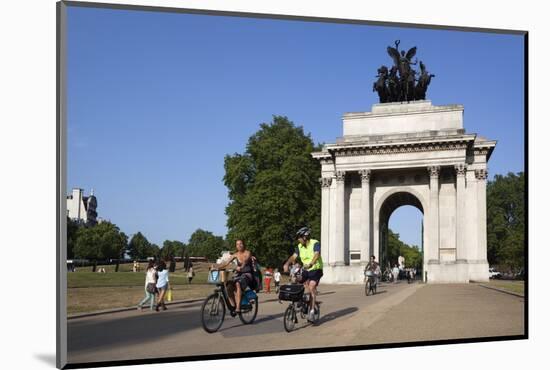 Cyclists under the Wellington Arch, Hyde Park Corner, London, England, United Kingdom, Europe-Stuart Black-Mounted Photographic Print