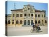 Cyclo Passing the Old Post Office in Phnom Penh in Cambodia, Indochina, Southeast Asia-Tim Hall-Stretched Canvas