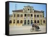 Cyclo Passing the Old Post Office in Phnom Penh in Cambodia, Indochina, Southeast Asia-Tim Hall-Framed Stretched Canvas