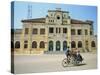 Cyclo Passing the Old Post Office in Phnom Penh in Cambodia, Indochina, Southeast Asia-Tim Hall-Stretched Canvas