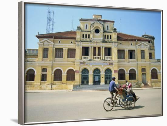 Cyclo Passing the Old Post Office in Phnom Penh in Cambodia, Indochina, Southeast Asia-Tim Hall-Framed Photographic Print