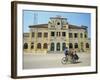 Cyclo Passing the Old Post Office in Phnom Penh in Cambodia, Indochina, Southeast Asia-Tim Hall-Framed Photographic Print