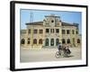 Cyclo Passing the Old Post Office in Phnom Penh in Cambodia, Indochina, Southeast Asia-Tim Hall-Framed Photographic Print