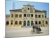 Cyclo Passing the Old Post Office in Phnom Penh in Cambodia, Indochina, Southeast Asia-Tim Hall-Mounted Photographic Print