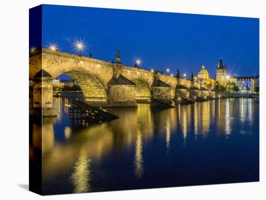 Czech Republic, Prague. Charles bridge water reflection at night.-Julie Eggers-Stretched Canvas