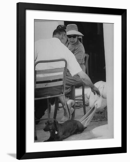 Dachshund Ignoring Pelican's Teasing-James Burke-Framed Photographic Print