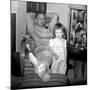 Dad Relaxes and Smokes His Pipe with His Four Year Old Daughter, Ca. 1958-null-Mounted Photographic Print