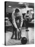 Dad Showing 3 Year Old Daughter the Basics of Bowling-George Silk-Stretched Canvas