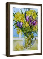 Daffodils and tulips in a glass jug by a window-Joan Thewsey-Framed Giclee Print