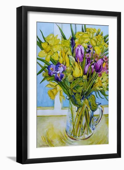 Daffodils and tulips in a glass jug by a window-Joan Thewsey-Framed Giclee Print