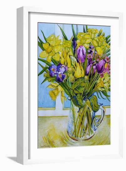 Daffodils and tulips in a glass jug by a window-Joan Thewsey-Framed Giclee Print