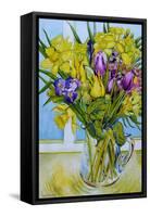 Daffodils and tulips in a glass jug by a window-Joan Thewsey-Framed Stretched Canvas