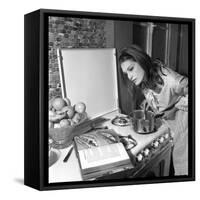 Dalida Ccooking in Her Kitchen-Marcel Begoin-Framed Stretched Canvas