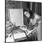 Dalida Ccooking in Her Kitchen-Marcel Begoin-Mounted Photographic Print