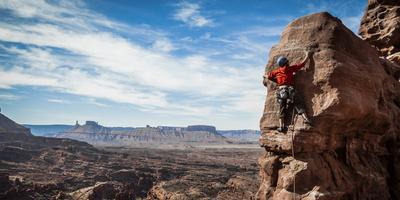 A Young Male Climber on the Third Pitch of the Classic Tower Climb, Fisher Towers, Moab, Utah