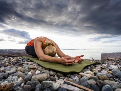 Yoga Position of Child's Pose in Lincoln Park - West Seattle, Washington