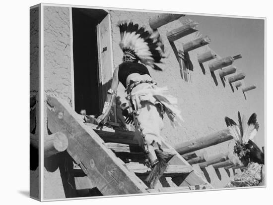 Dance San Ildefonso Pueblo New Mexico 1942 Two Indians In Headdress Ascending Stairs To House 1942-Ansel Adams-Stretched Canvas