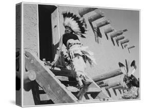 Dance San Ildefonso Pueblo New Mexico 1942 Two Indians In Headdress Ascending Stairs To House 1942-Ansel Adams-Stretched Canvas