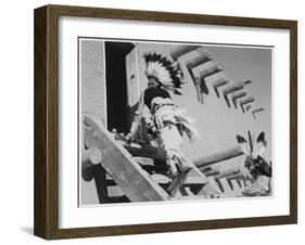 Dance San Ildefonso Pueblo New Mexico 1942 Two Indians In Headdress Ascending Stairs To House 1942-Ansel Adams-Framed Art Print