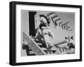 Dance San Ildefonso Pueblo New Mexico 1942 Two Indians In Headdress Ascending Stairs To House 1942-Ansel Adams-Framed Art Print