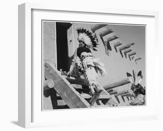 Dance San Ildefonso Pueblo New Mexico 1942 Two Indians In Headdress Ascending Stairs To House 1942-Ansel Adams-Framed Art Print