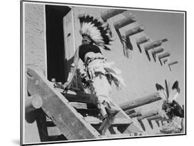 Dance San Ildefonso Pueblo New Mexico 1942 Two Indians In Headdress Ascending Stairs To House 1942-Ansel Adams-Mounted Art Print