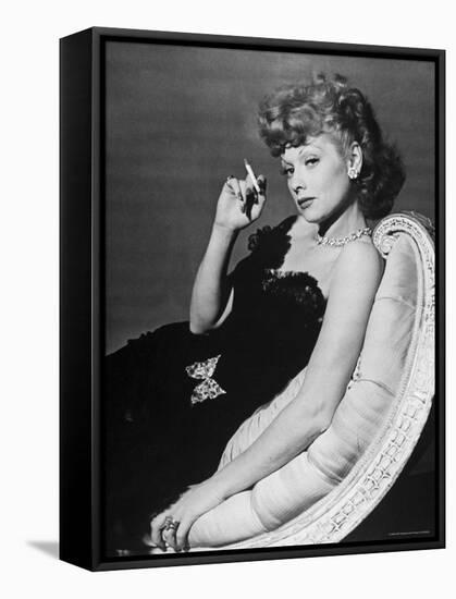 Dancer/Actress Lucille Ball in Strapless Black Lace Evening Dress, Holding Lit Cigarette on Couch-John Florea-Framed Stretched Canvas