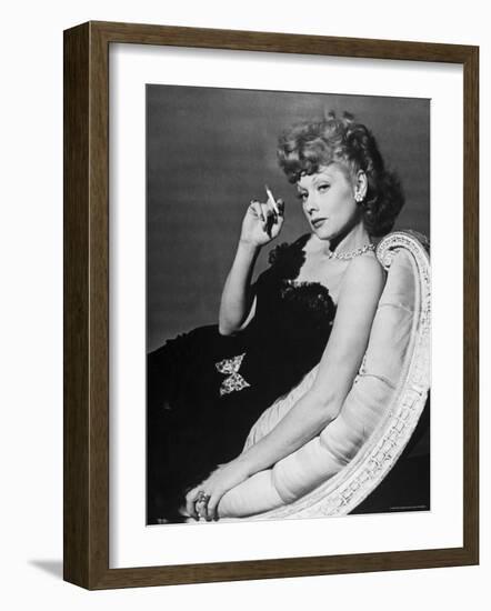 Dancer/Actress Lucille Ball in Strapless Black Lace Evening Dress, Holding Lit Cigarette on Couch-John Florea-Framed Premium Photographic Print