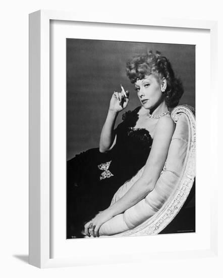 Dancer/Actress Lucille Ball in Strapless Black Lace Evening Dress, Holding Lit Cigarette on Couch-John Florea-Framed Premium Photographic Print