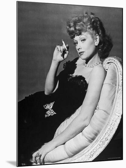 Dancer/Actress Lucille Ball in Strapless Black Lace Evening Dress, Holding Lit Cigarette on Couch-John Florea-Mounted Premium Photographic Print