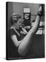 Dancer Mary Ellen Terry Talking with Her Legs Up in Telephone Booth-Gordon Parks-Stretched Canvas