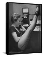 Dancer Mary Ellen Terry Talking with Her Legs Up in Telephone Booth-Gordon Parks-Framed Stretched Canvas