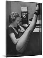 Dancer Mary Ellen Terry Talking with Her Legs Up in Telephone Booth-Gordon Parks-Mounted Photographic Print