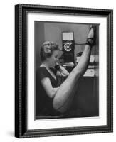 Dancer Mary Ellen Terry Talking with Her Legs Up in Telephone Booth-Gordon Parks-Framed Photographic Print