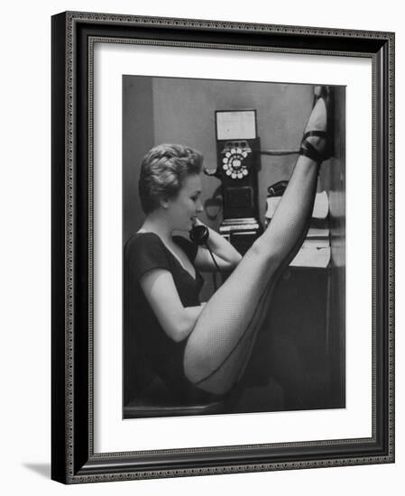 Dancer Mary Ellen Terry Talking with Her Legs Up in Telephone Booth-Gordon Parks-Framed Photographic Print