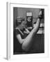 Dancer Mary Ellen Terry Talking with Her Legs Up in Telephone Booth-Gordon Parks-Framed Photographic Print