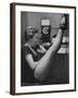 Dancer Mary Ellen Terry Talking with Her Legs Up in Telephone Booth-Gordon Parks-Framed Photographic Print