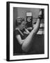 Dancer Mary Ellen Terry Talking with Her Legs Up in Telephone Booth-Gordon Parks-Framed Photographic Print