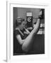 Dancer Mary Ellen Terry Talking with Her Legs Up in Telephone Booth-Gordon Parks-Framed Photographic Print