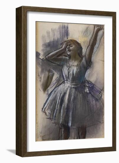 Dancer stretching. Around 1882-1885. Pastel on pale blue-grey paper.-Edgar Degas-Framed Giclee Print