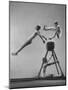 Danish Gymnasts Erik Hansen Followed by John Thomsen Do High Thief Jump as Team Member Braces Buck-Gjon Mili-Mounted Photographic Print