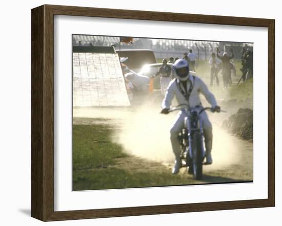 Daredevil Motorcyclist Evel Knievel Raising Dust after Completing Stunt-null-Framed Photographic Print