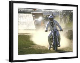 Daredevil Motorcyclist Evel Knievel Raising Dust after Completing Stunt-null-Framed Photographic Print