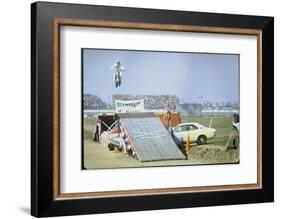 Daredevil Motorcyclist Evel Knievel Rising Very High Off Platform During Performance of a Stunt-Bill Eppridge-Framed Photographic Print