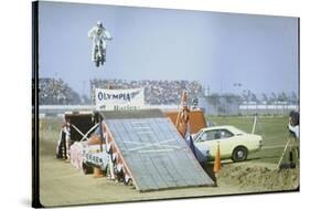 Daredevil Motorcyclist Evel Knievel Rising Very High Off Platform During Performance of a Stunt-Bill Eppridge-Stretched Canvas