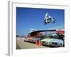 Daredevil Motorcyclist Evil Knievel in Mid Jump over a Row of Cars-Ralph Crane-Framed Premium Photographic Print