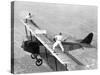 Daredevils Playing Tennis on a Biplane-null-Stretched Canvas