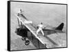 Daredevils Playing Tennis on a Biplane-null-Framed Stretched Canvas