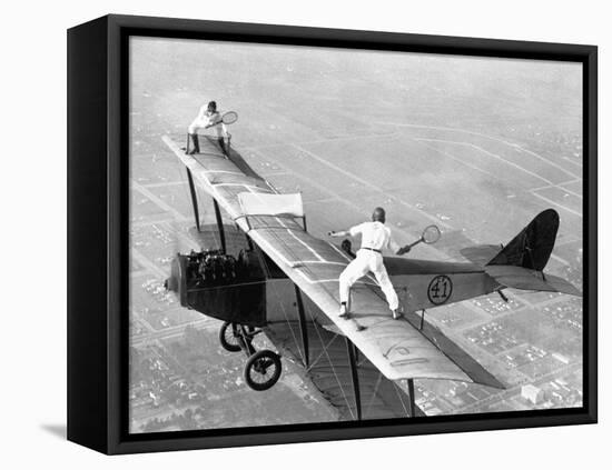 Daredevils Playing Tennis on a Biplane-null-Framed Stretched Canvas