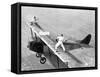 Daredevils Playing Tennis on a Biplane-null-Framed Stretched Canvas